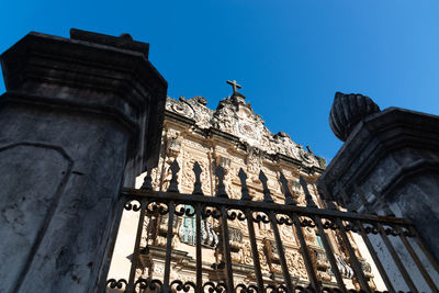 Low angle view of historical building against blue sky