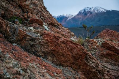 Close-up of rocky mountains against sky