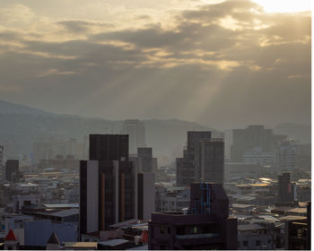 High angle view of buildings against sky during sunset