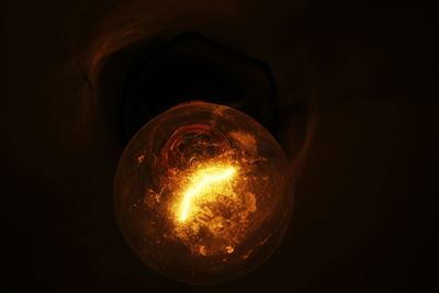 Close-up of illuminated light bulb