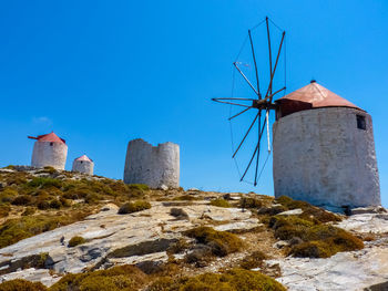 Traditional windmill against clear blue sky