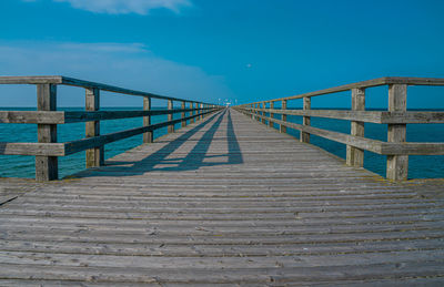 View of pier on sea against sky
