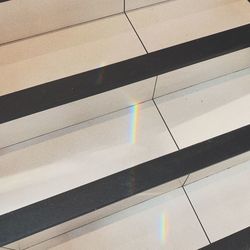 High angle view of multi colored shadow on floor