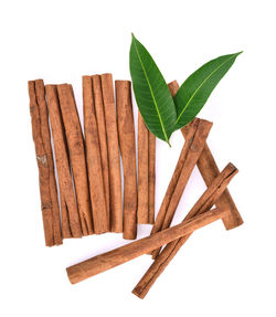 High angle view of leaf on wood against white background