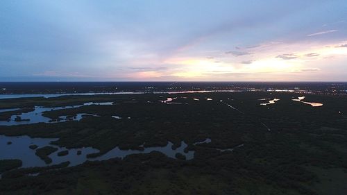 Scenic view of sea against sky at sunset