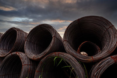 Steel wire coil against dark sky. metal steel reinforced for concrete construction. iron wire.