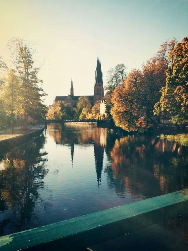 architecture, built structure, tree, building exterior, reflection, water, clear sky, lake, waterfront, river, sky, religion, place of worship, tranquility, nature, pond, spirituality, travel destinations, standing water, outdoors