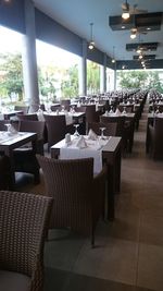 Empty chairs and tables in restaurant