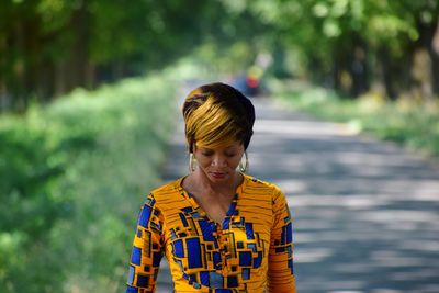 Woman standing on road