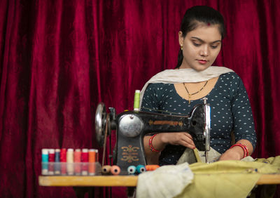 Portrait of young woman working at home