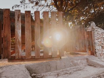 Panoramic shot of building by trees against sky