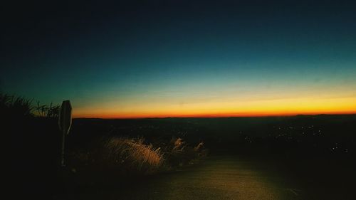 Scenic view of silhouette landscape against sky at sunset