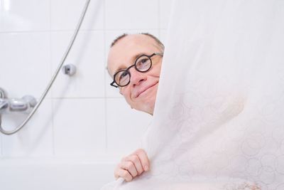 Portrait of man in bathroom