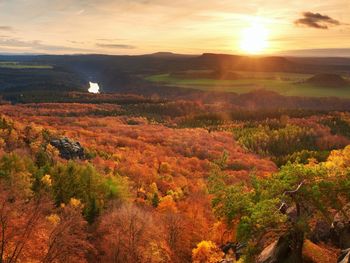 Scenic view of landscape against sky during sunset