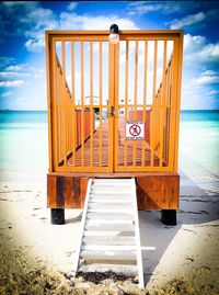 View of beach against cloudy sky