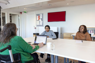 Disabled woman during meeting in office