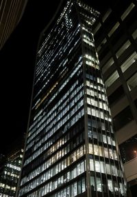 Low angle view of modern building at night