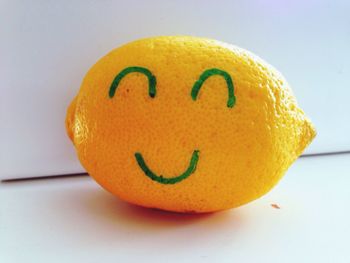 Smiley face drawn on lemon