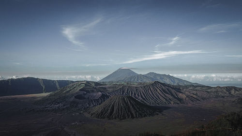 Panoramic view of arid landscape against sky