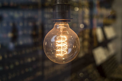 Close-up of illuminated light bulb