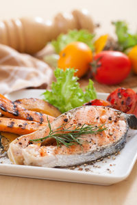 Close-up of fish served in plate on table