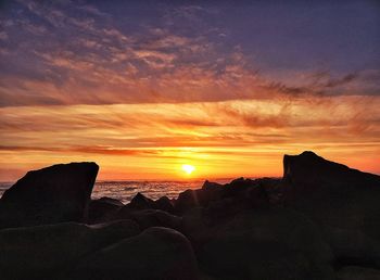 Scenic view of sunset over sea
