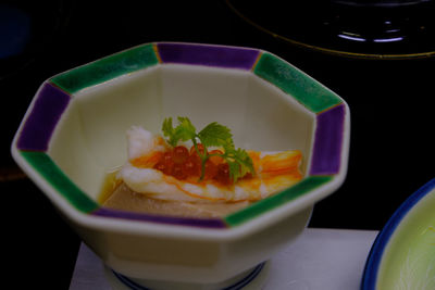 High angle view of serving fish in plate on table