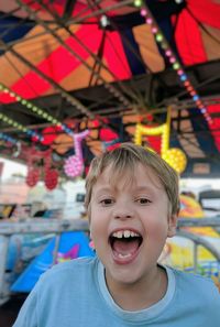 Portrait of smiling boy at amusement park