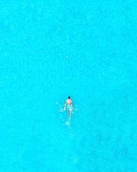 High angle view of man swimming in sea