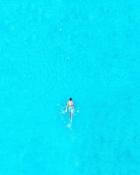 Aerial view of man swimming in sea