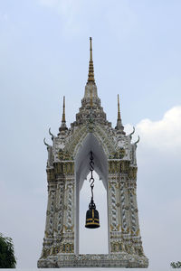 Low angle view of bell tower against sky