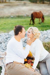 Couple sitting on a field