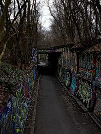 Graffiti on wall of empty footpath