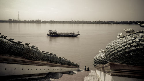 Scenic view of sea against sky in city