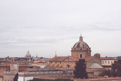 Buildings in city against sky