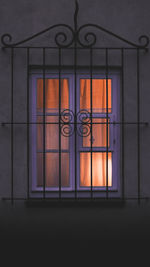 Illuminated building seen through glass window