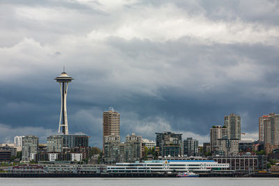 Seattle skyline with modern buildings against ominous clouds in background