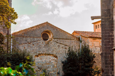 Low angle view of old building against sky