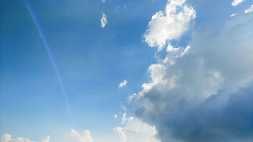 Low angle view of vapor trail in blue sky