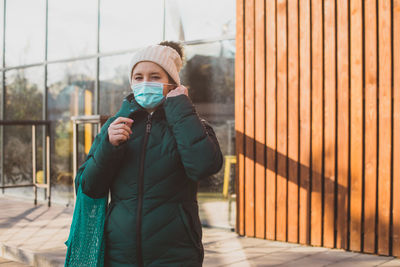 Woman in warm clothing during pandemic