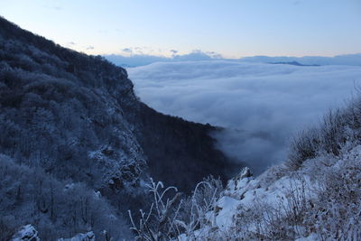 Scenic view of mountains against sky during winter