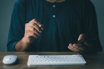 Men are using computer for social media and online marketing including working from home