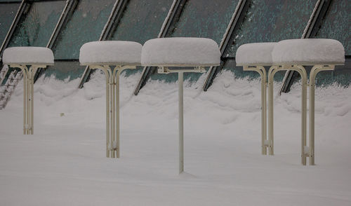 Row of chairs in snow