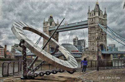 View of bridge against cloudy sky