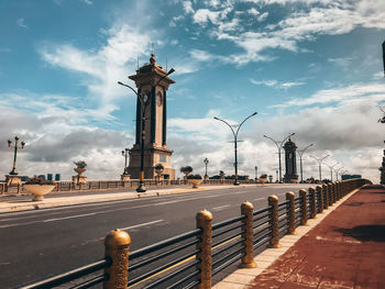 View of street against cloudy sky