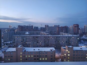 High angle view of buildings in city against sky