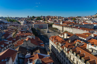 High angle view of townscape against blue sky