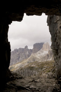 Scenic view rocky mountains at dolomites against cloudy sky