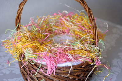 High angle view of candies in basket on table