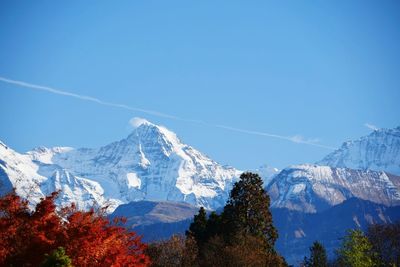 Scenic view of mountains against cloudy sky